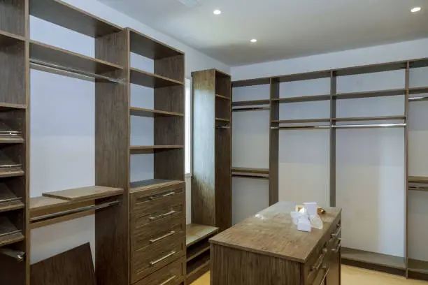 Finished custom closet systems for walk-in closets installed in a modern Virginia home