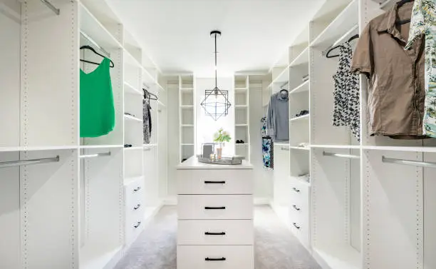Walk-in closet systems with dividers by KBR closet companies near me in Bethesda.