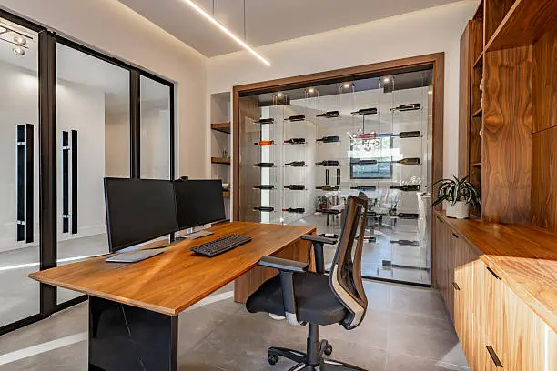 Home office with integrated desk and custom closet systems, crafted by KBR Closet for efficient workspaces.