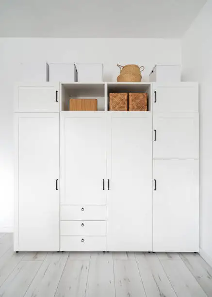 Renters’ vertical closet with stackable units in a studio