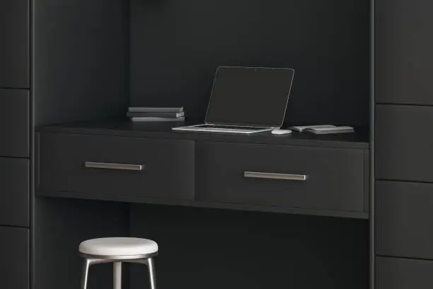 A close-up of a home office closet with a built-in desk, filing drawers, and LED lighting, designed for efficiency