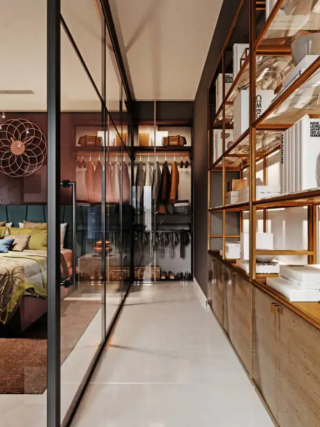 A sophisticated walk-in closet with glass cabinets and elegant shelving, transforming a bedroom into a luxurious space