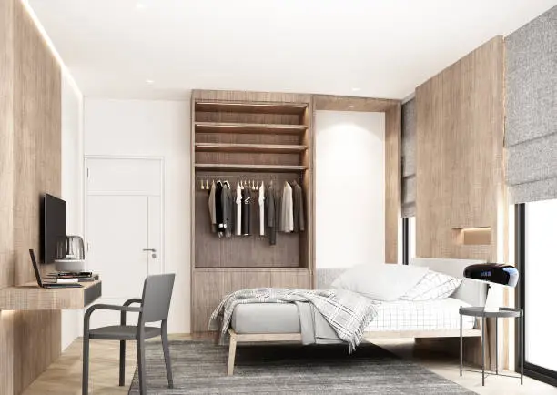 A compact custom wardrobe in a guest room with vertical shelving and stylish finishes for efficient organization