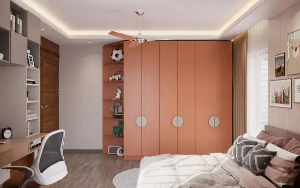A compact custom wardrobe in a kids’ room with vertical storage and vibrant finishes for functionality